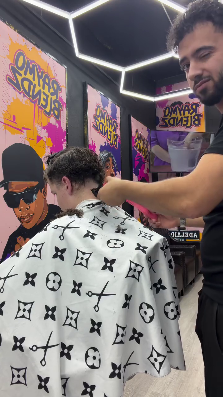 Barber at work at Raymo Blends Hallett Cove